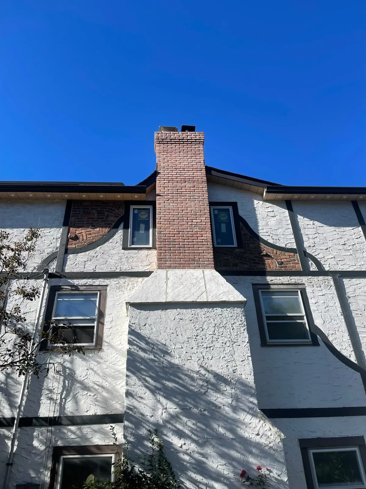 Exterior brick chimney on the front of a home