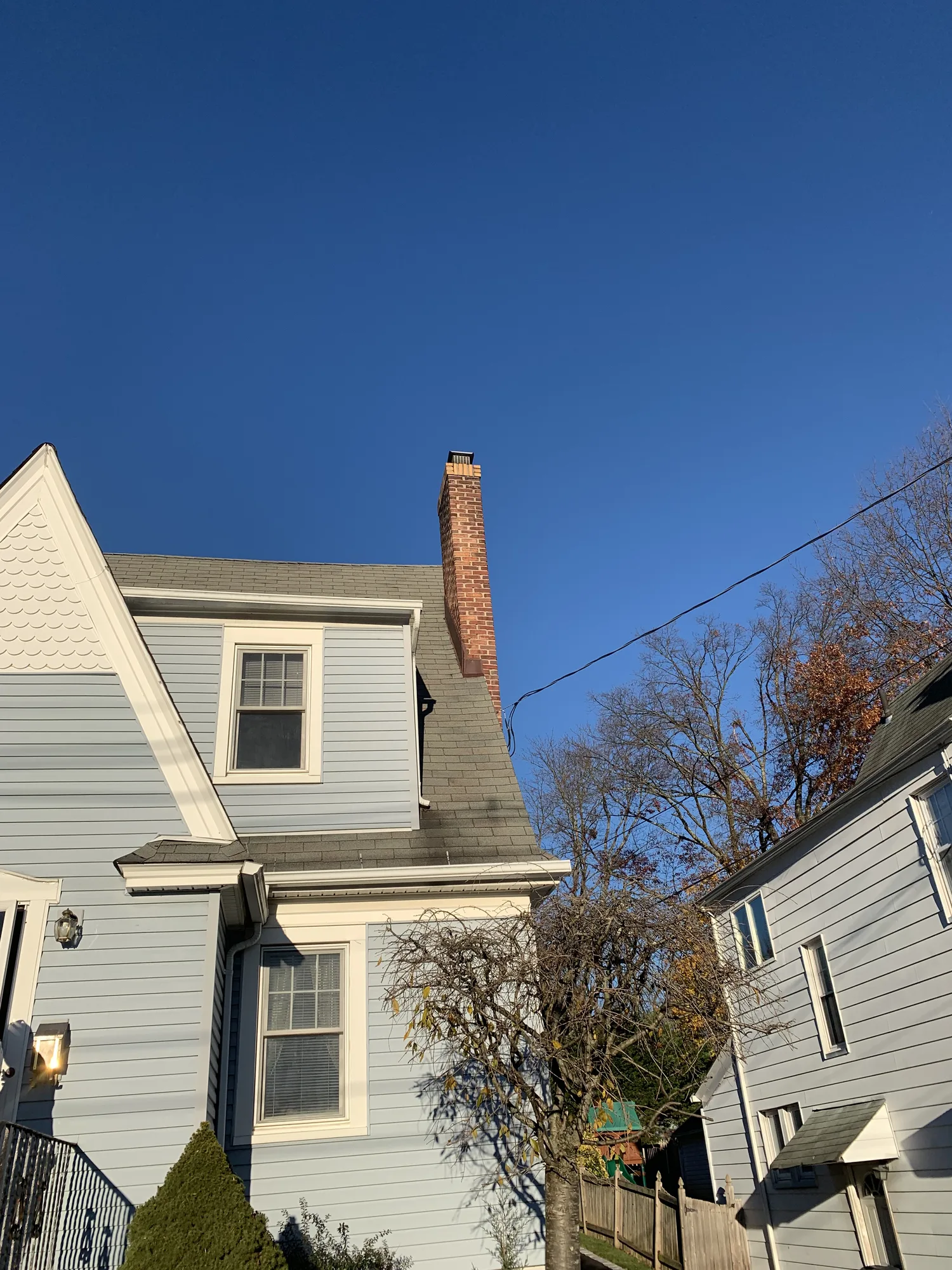 Residential exterior chimney and its connection with the roof