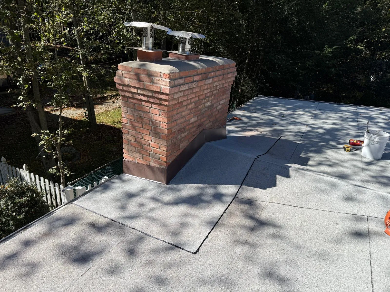 Flue liner openings at the top of a completed brick chimney
