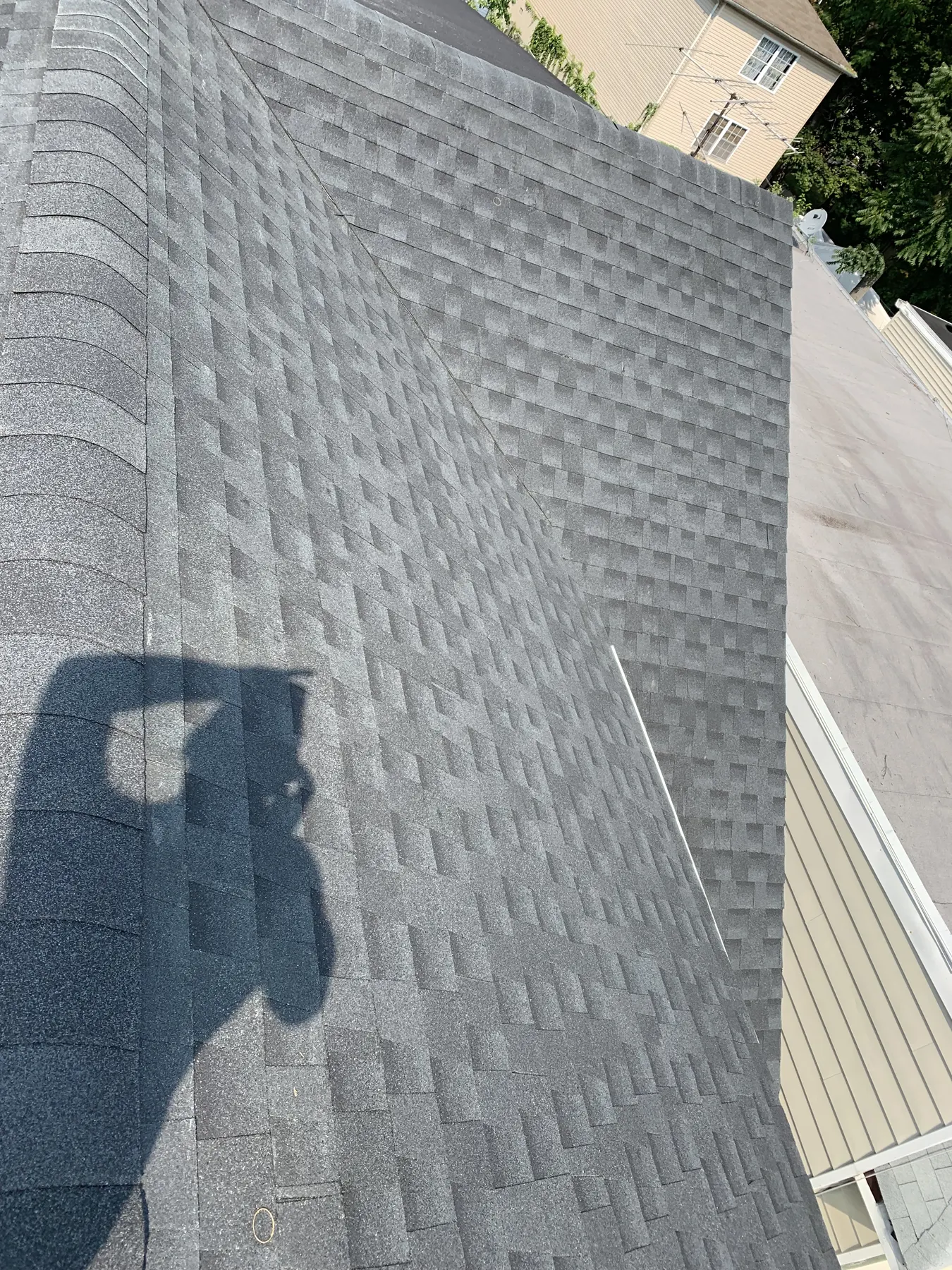 Shingled roof ridge and adjoining roof slope