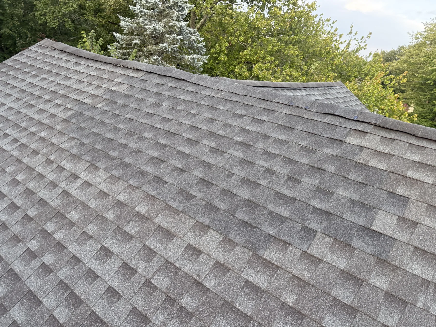 Finished asphalt shingles across a residential roof