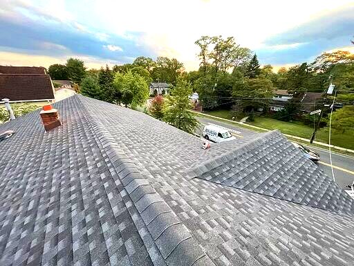 Residential roof covered with asphalt shingles
