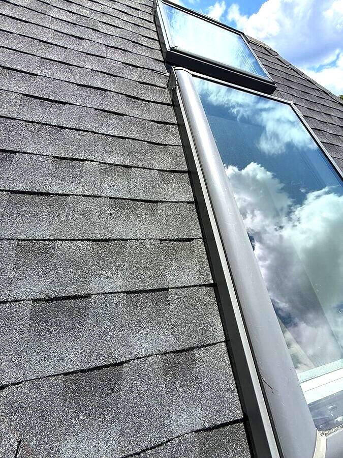Skylight and surrounding asphalt shingles